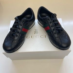 Gucci Embossed Black Sneakers With White Trim